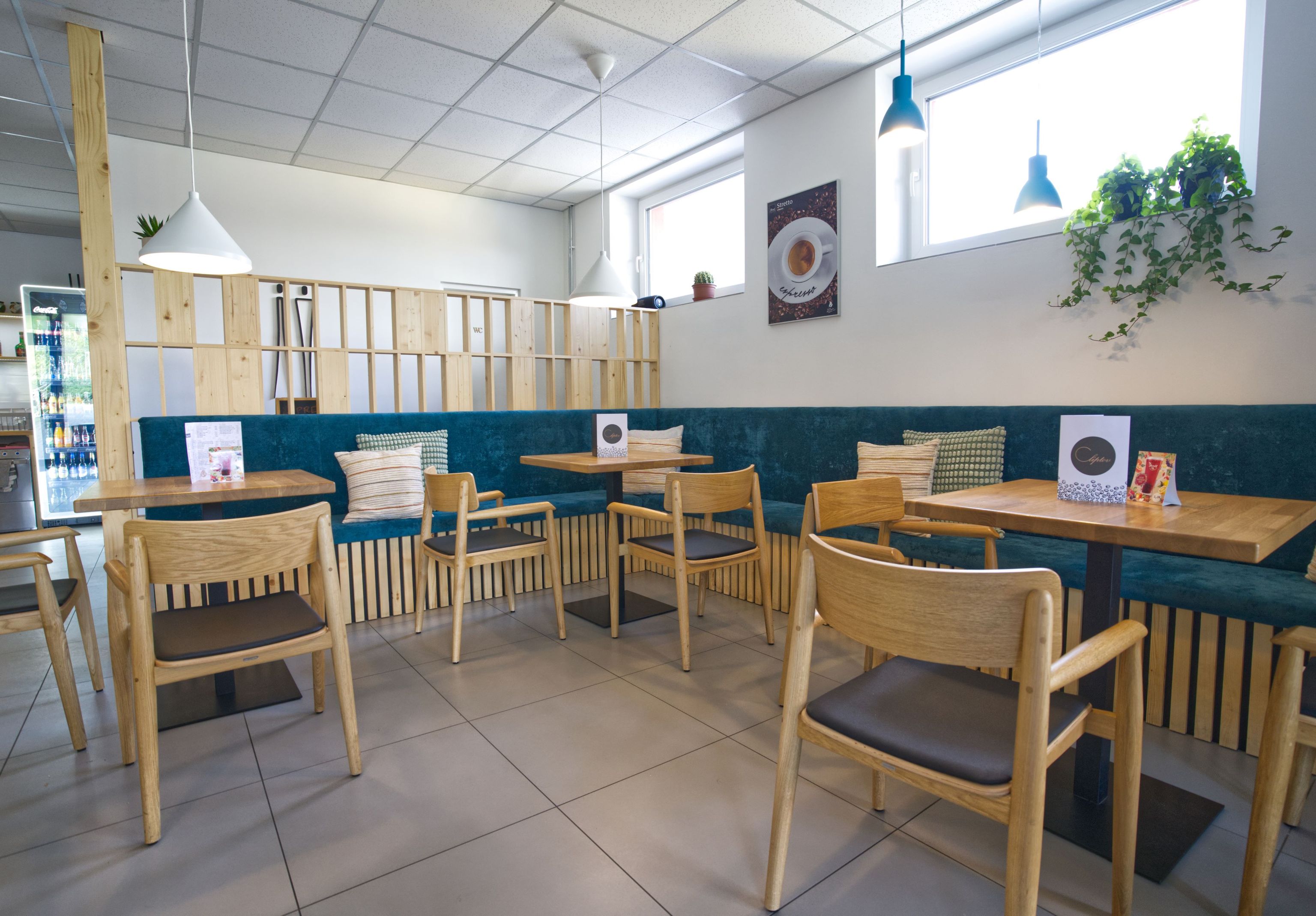 Image inside the coffee shop showing the tables for sitting together.