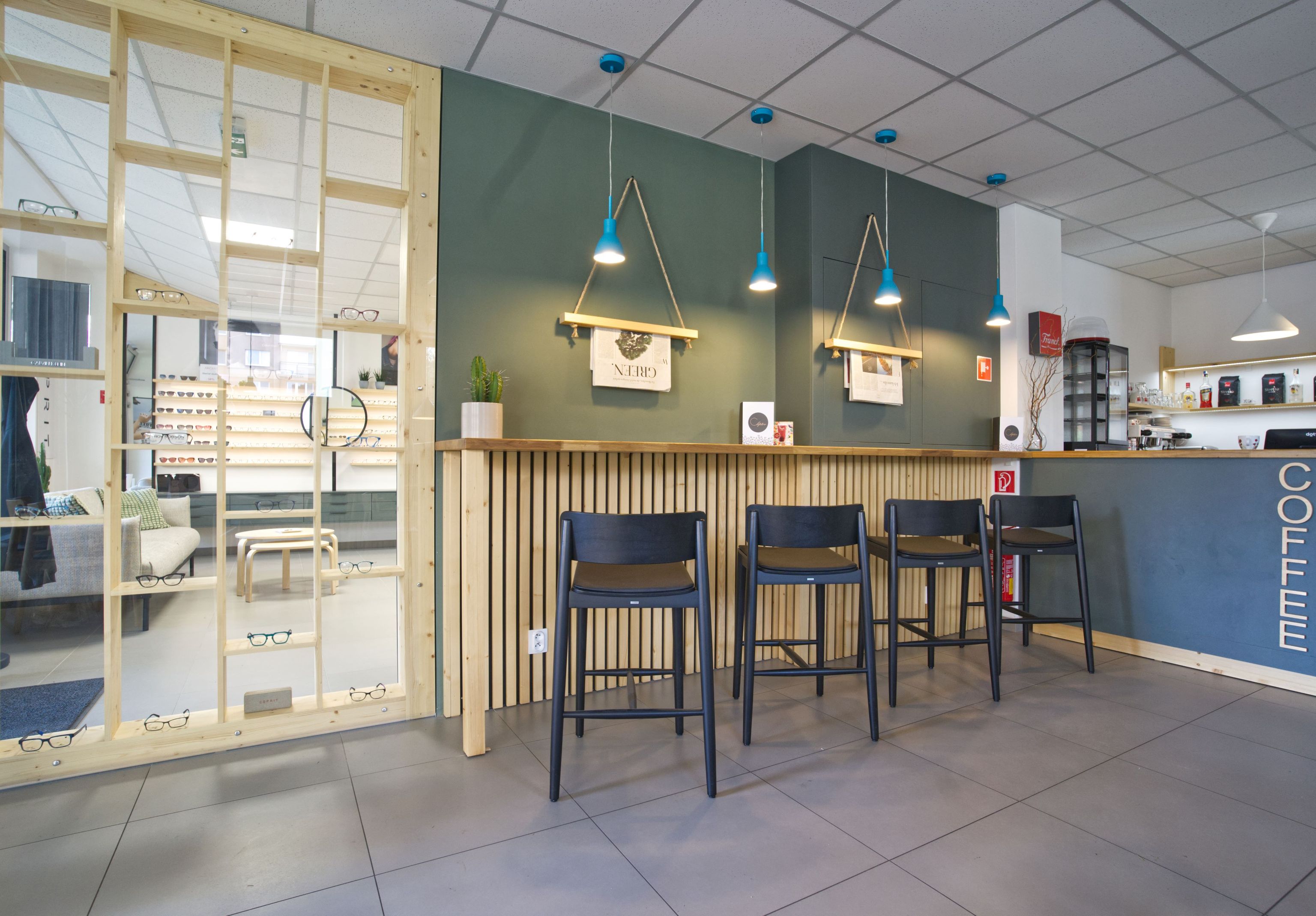 Image inside the coffee shop showing the individual sitting space with high chairs.