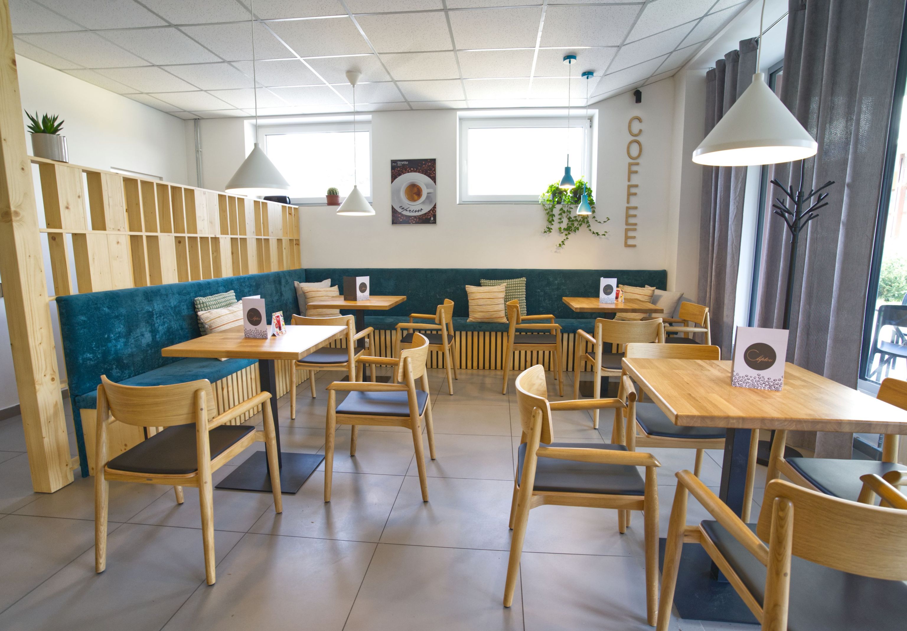 Image inside the coffee shop showing the tables for sitting together.