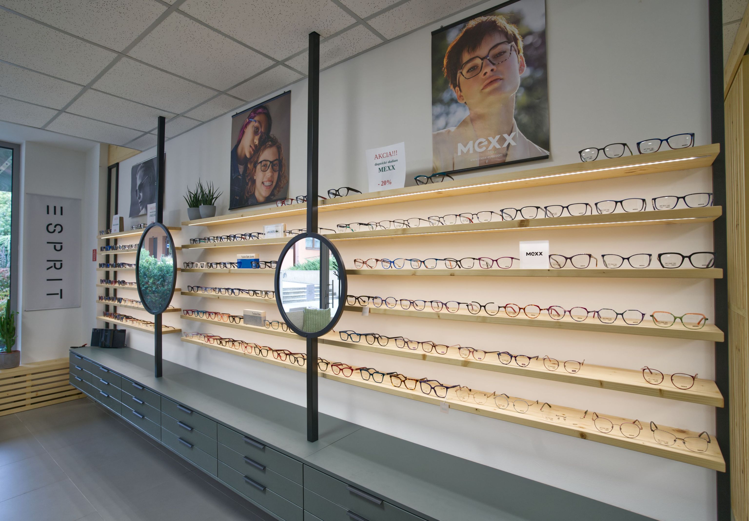 Image inside the opticians showing rows of glasses on sale.