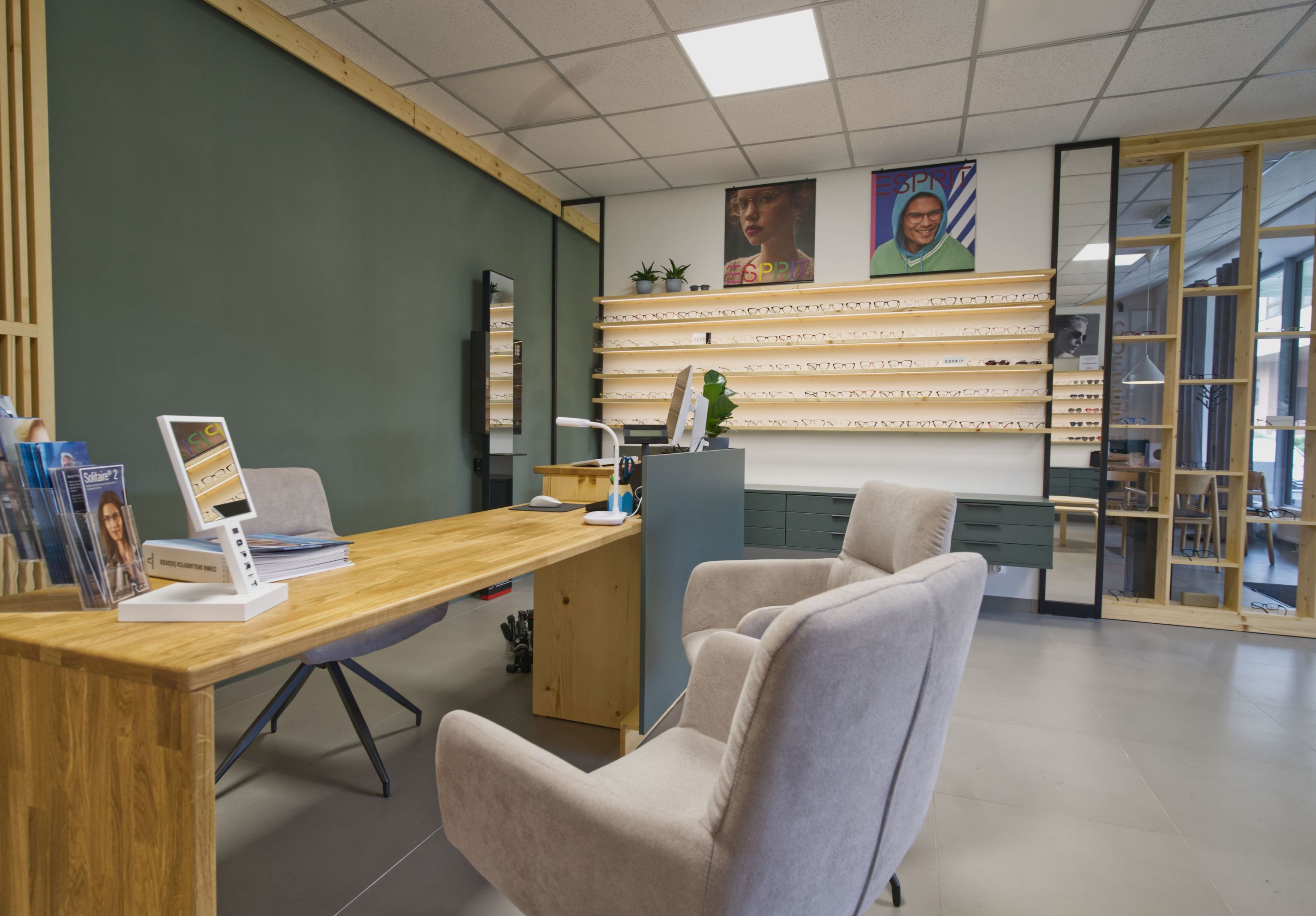 Image inside the opticians showing the main table where customers sit.